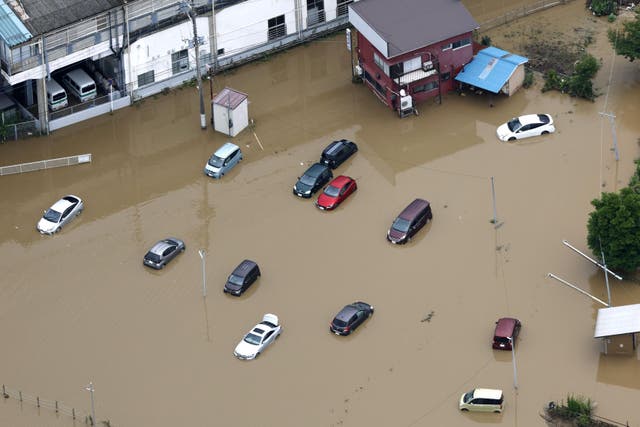 Eight dead, and over 10K left stranded as record-breaking rain pummels Japan