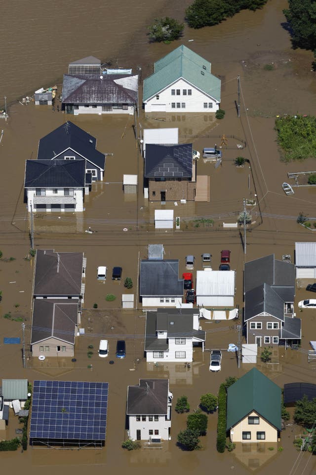 Eight dead, and over 10K left stranded as record-breaking rain pummels Japan