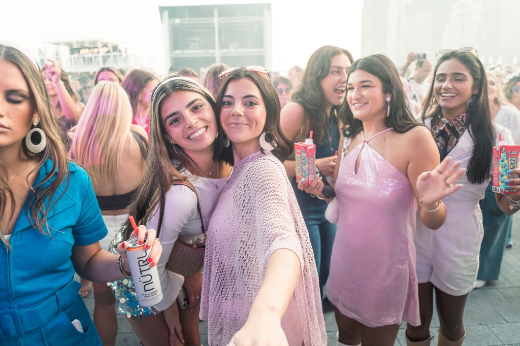 Thousands of jumpsuit-clad partiers boogie to 1970s hits at annual Gimme Gimme party: ‘I just keep coming back’