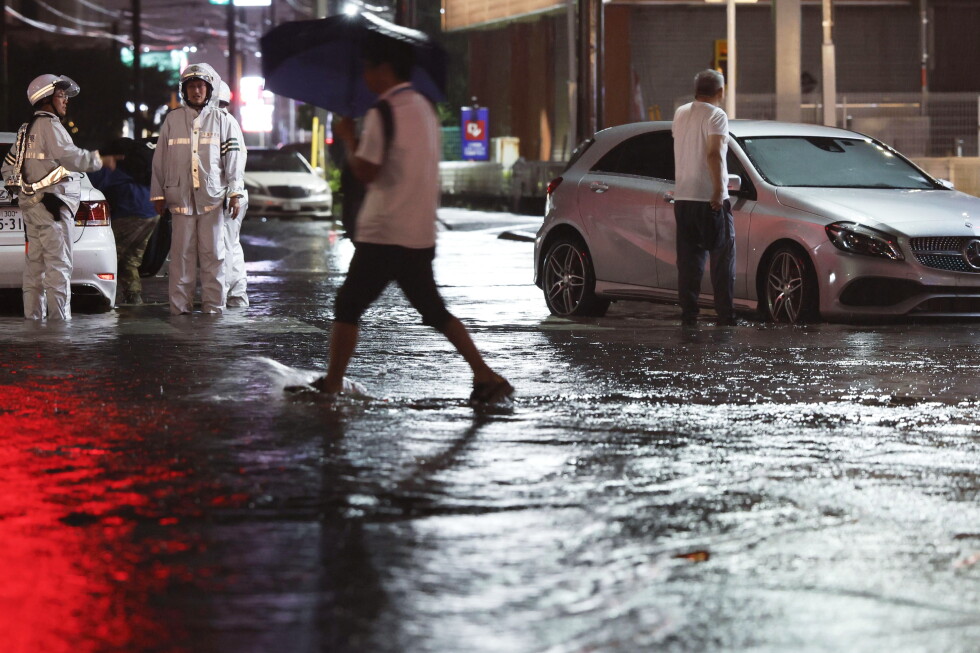 Eight dead, and over 10K left stranded as record-breaking rain pummels Japan