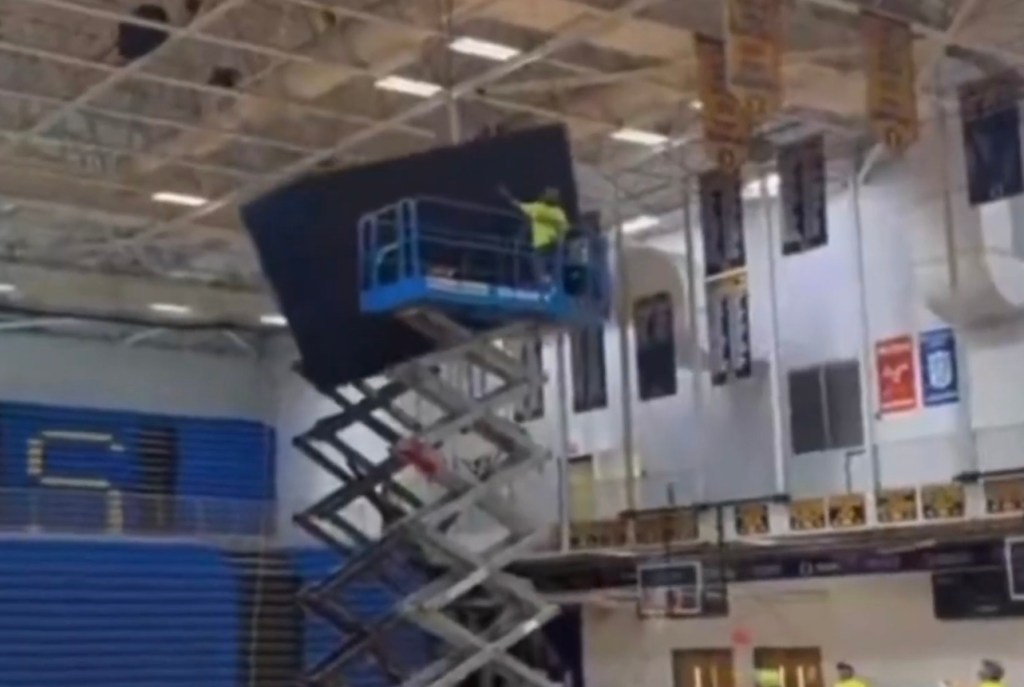 Extraordinary video shows failed jumbotron installation — shatters into pieces as it slams on gym floor