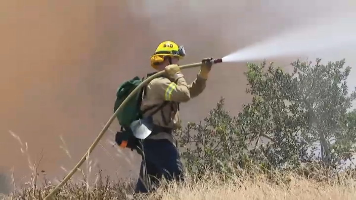 Fast-moving fire breaks out in San Diego, forcing evacuations