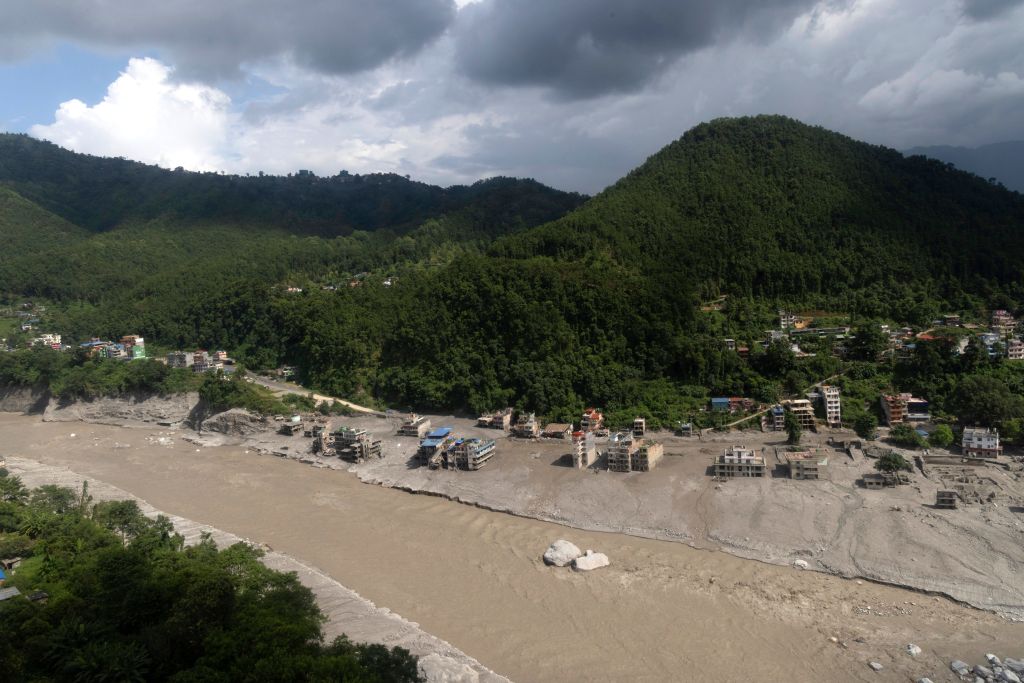 Young survivor of catastrophic flooding in Nepal reunites with his mother — who feared her 2 kids were dead