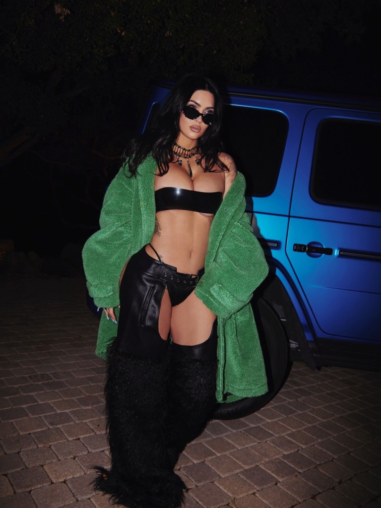 Megan Fox shows some skin in latex bandeau and leather chaps