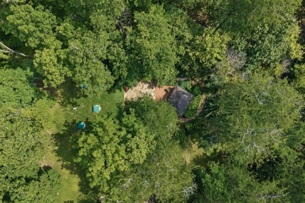 Earth-sheltered Ohio home that is built almost entirely underground comes with a roof you have to mow