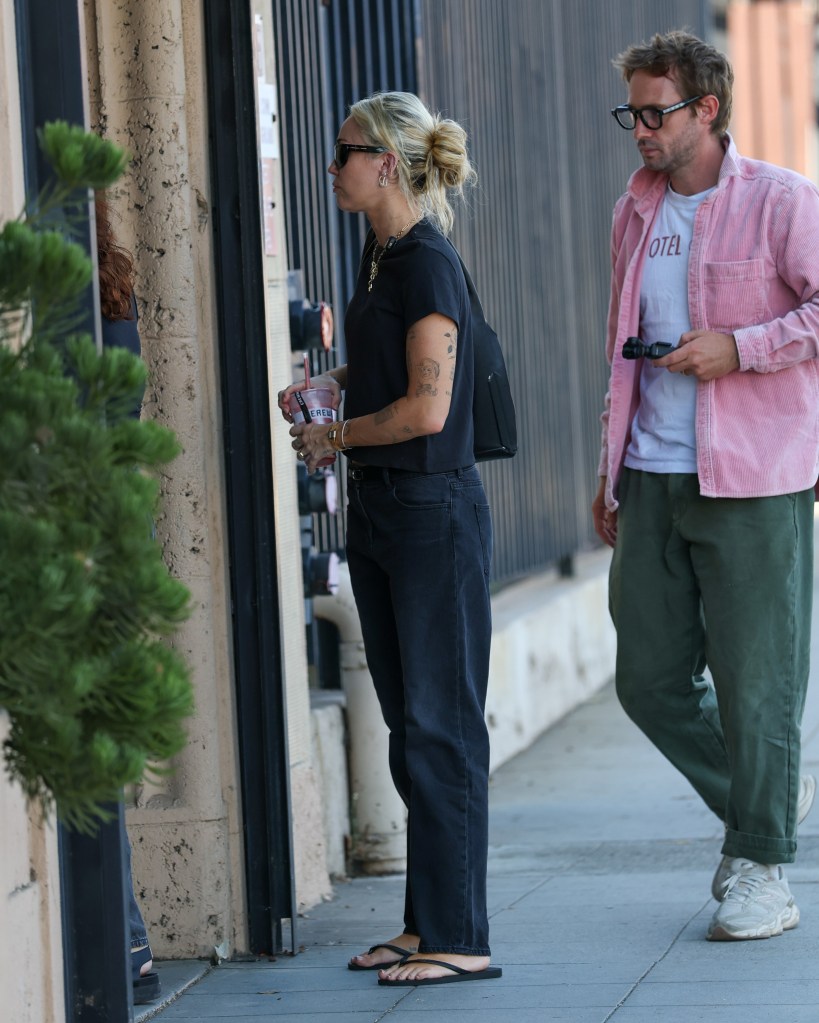 Somber Miley Cyrus arrives at LA studio in first outing since godmother Dolly Parton’s death
