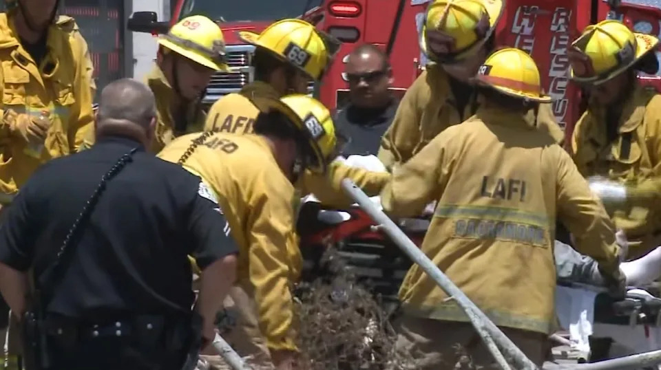 Firefighters using hydraulic extraction tools during the rescue operation