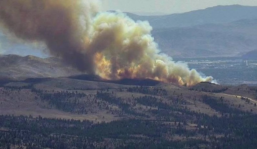 Wildfire explodes across Nevada border as California evacuation warnings issued