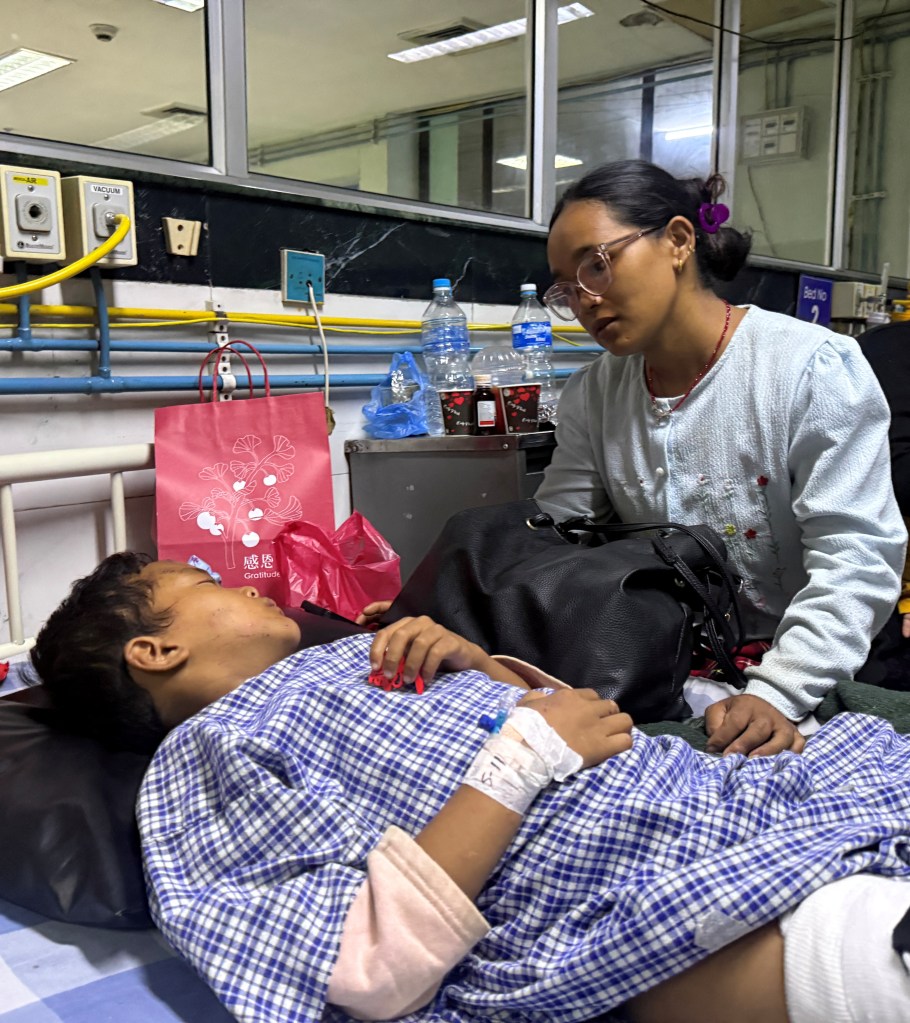 Young survivor of catastrophic flooding in Nepal reunites with his mother — who feared her 2 kids were dead