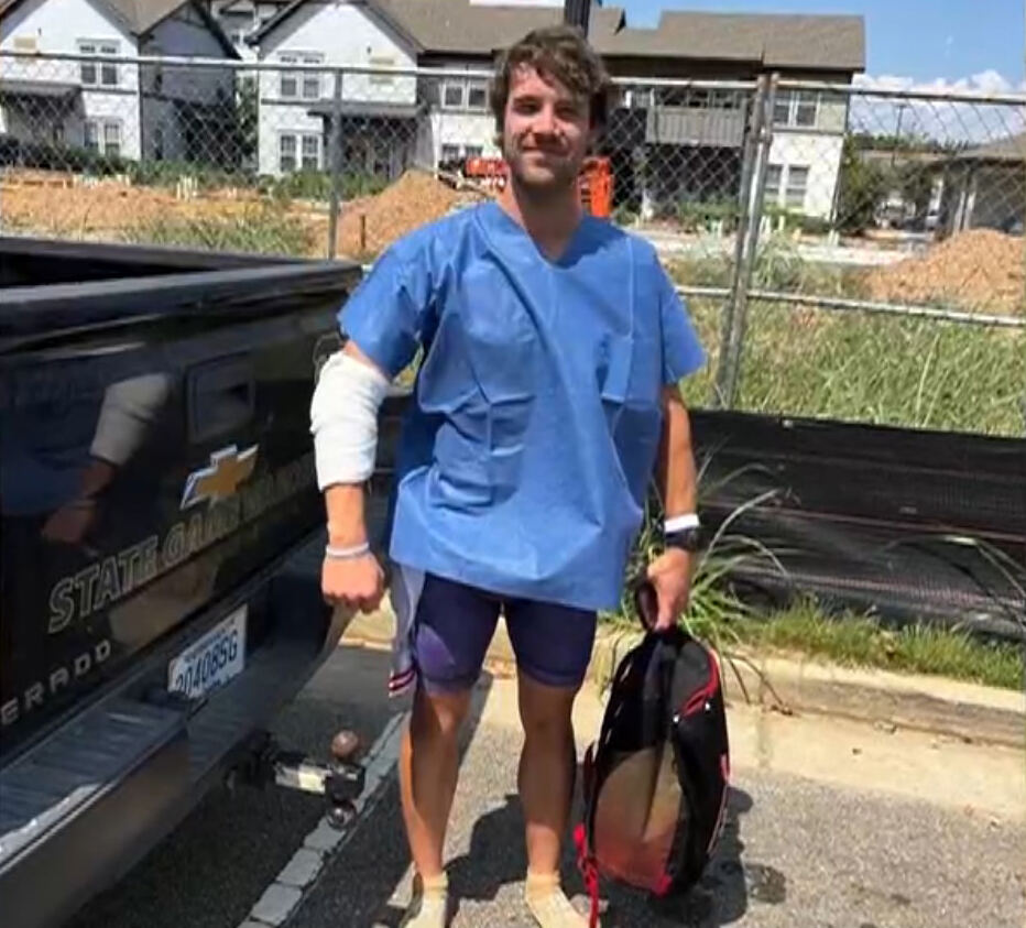 Triathlon coach, 31, savaged by alligator as beast clamped onto his arm during race training
