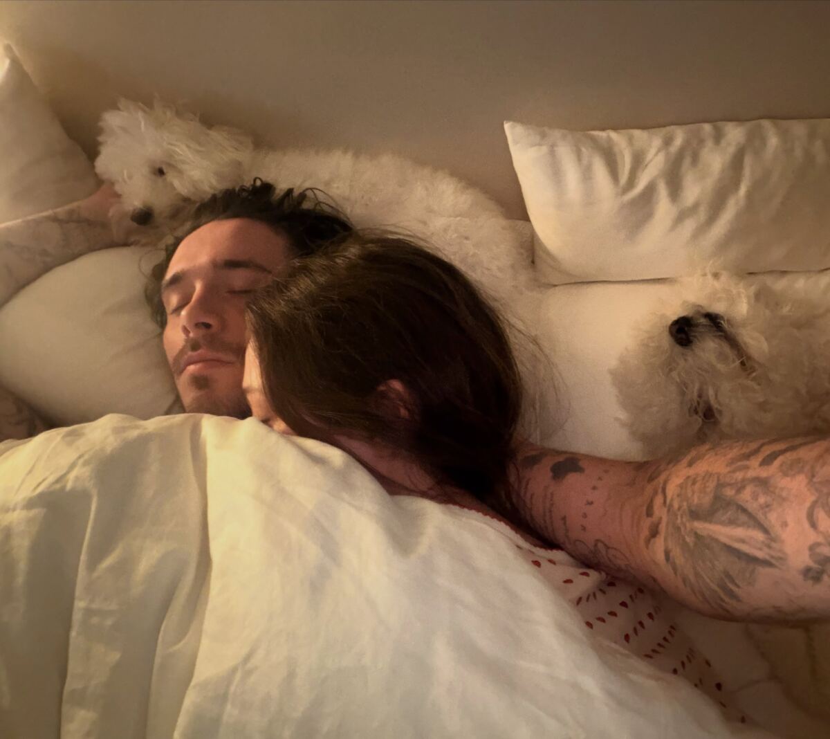 Brooklyn Beckham shares intimate bed snaps with Nicola Peltz as dad David plays happy family amid feud