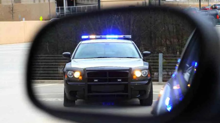 Kaamil O'Berry climbing onto the hood of the victim's vehicle on I-75