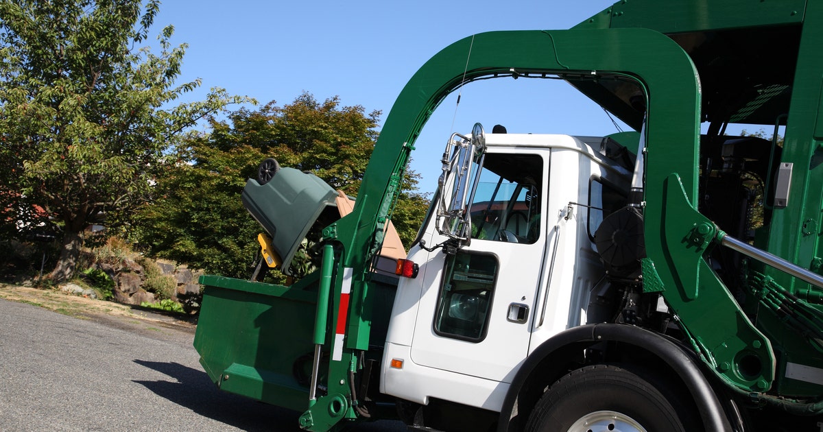 Sanitation worker, 32, dies after falling from back of truck his dad was driving on first day of new job