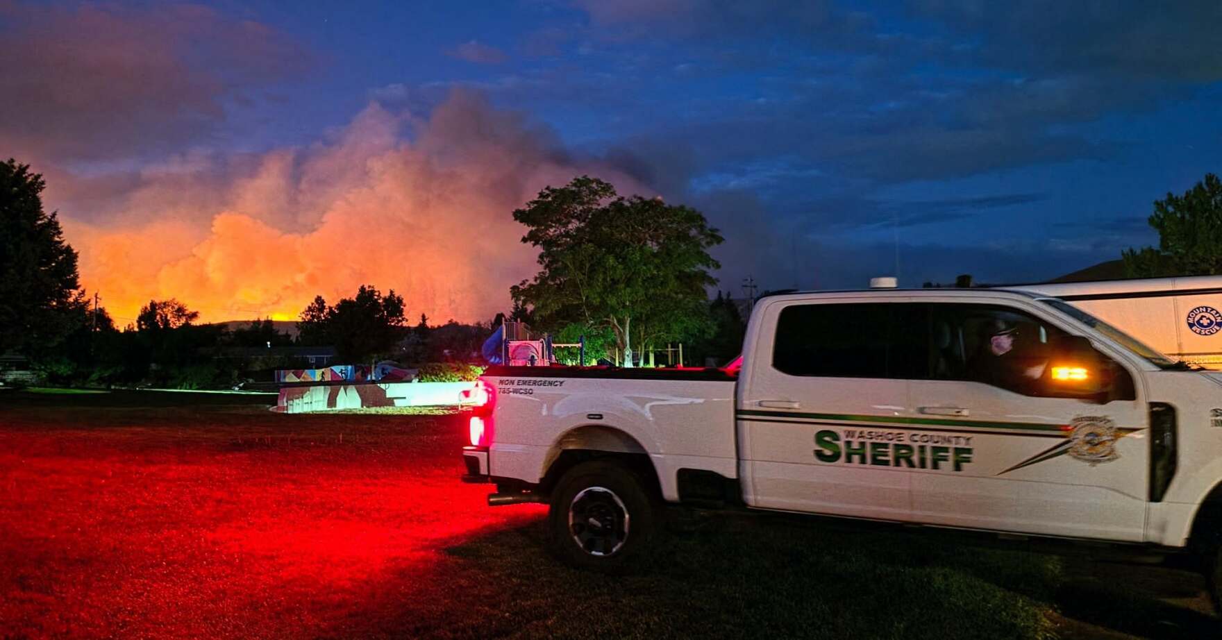 Two massive wildfires converge to rip across 44,000 acres on California-Nevada border as evacuations underway