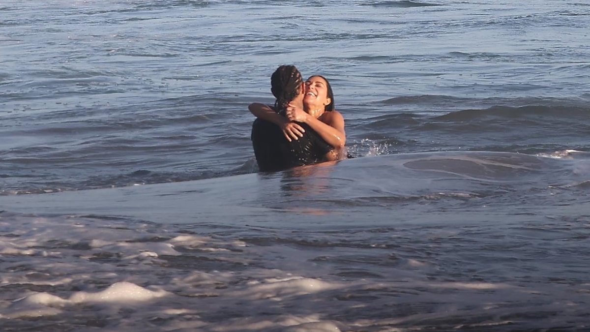 Kim Kardashian surfs in Gucci bikini on vacation with Lewis Hamilton and family