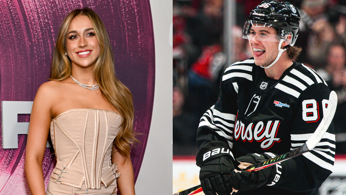Tate McRae cheering on Jack Hughes at a New Jersey Devils game during their relationship