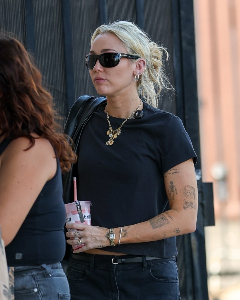 Somber Miley Cyrus arrives at LA studio in first outing since godmother Dolly Parton’s death
