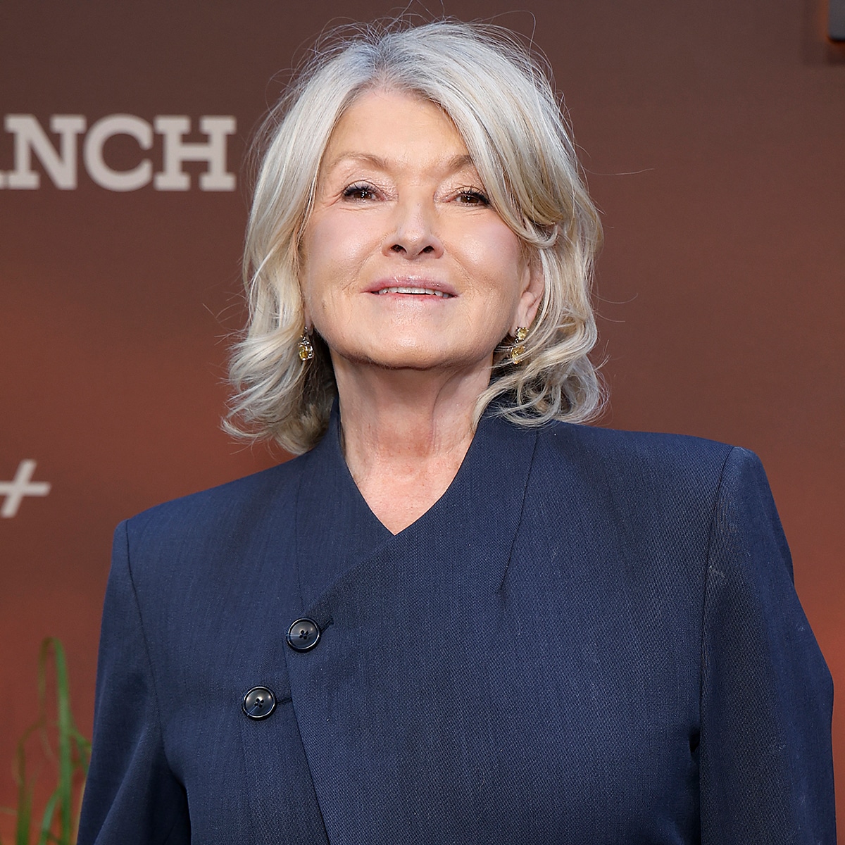 Martha Stewart smiling and posing to show off her new rose gold hair color