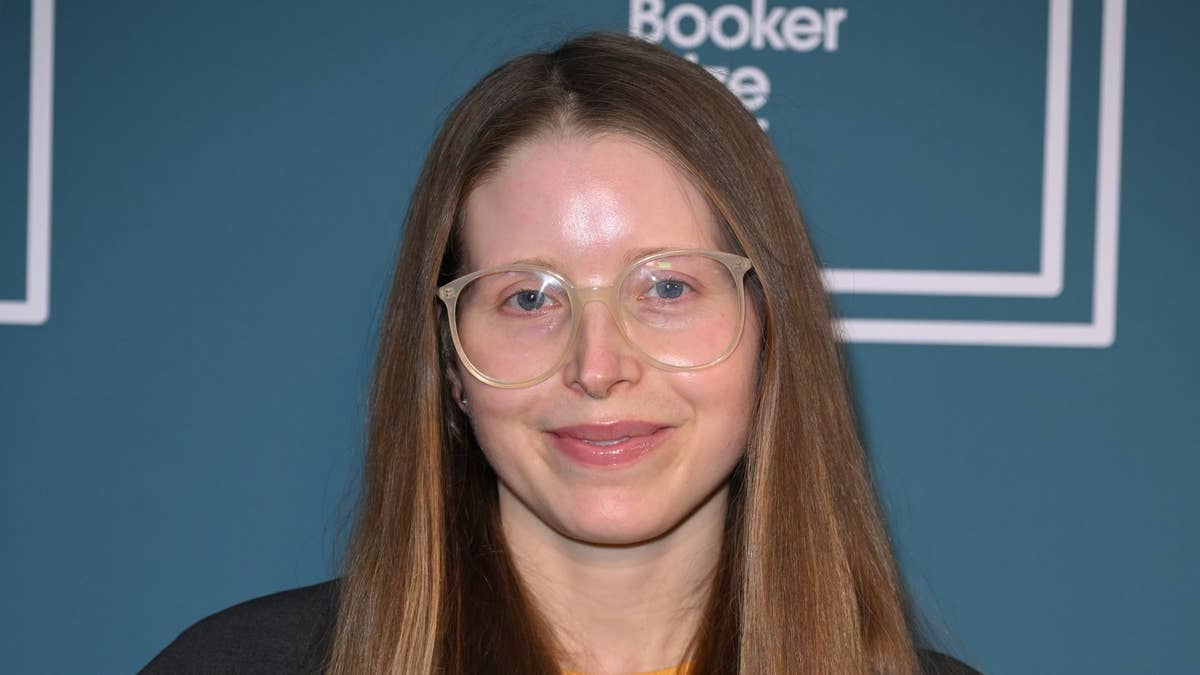 Jessie Cave celebrating milestone earnings from her OnlyFans account.