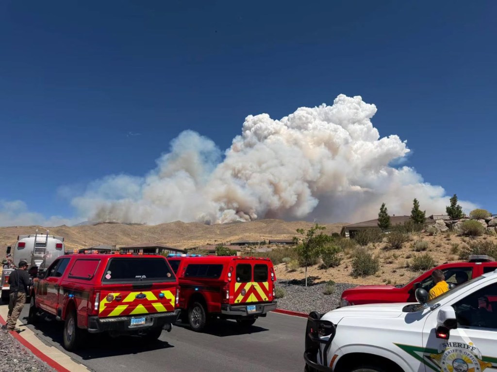 Wildfire explodes across Nevada border as California evacuation warnings issued