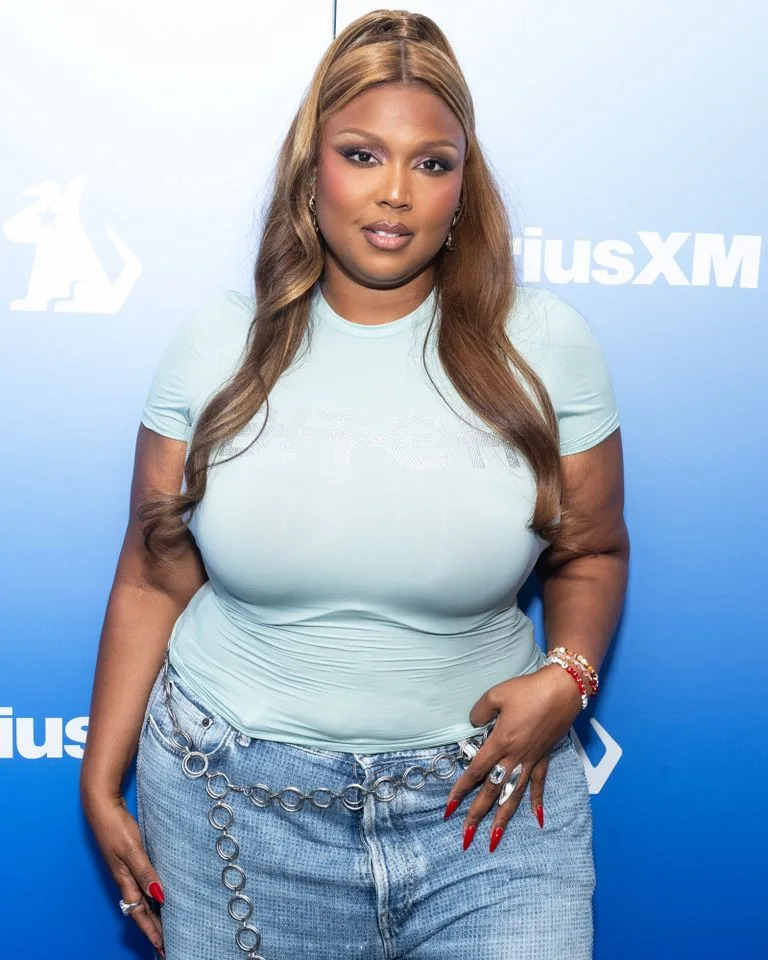 Lizzo rings in ‘Fat Liberation Month’ in a teeny purple string bikini