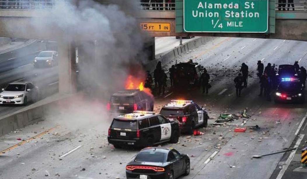 Illegal migrant who sprayed lighter fluid on burning cop car in wild anti-ICE riot learns fate