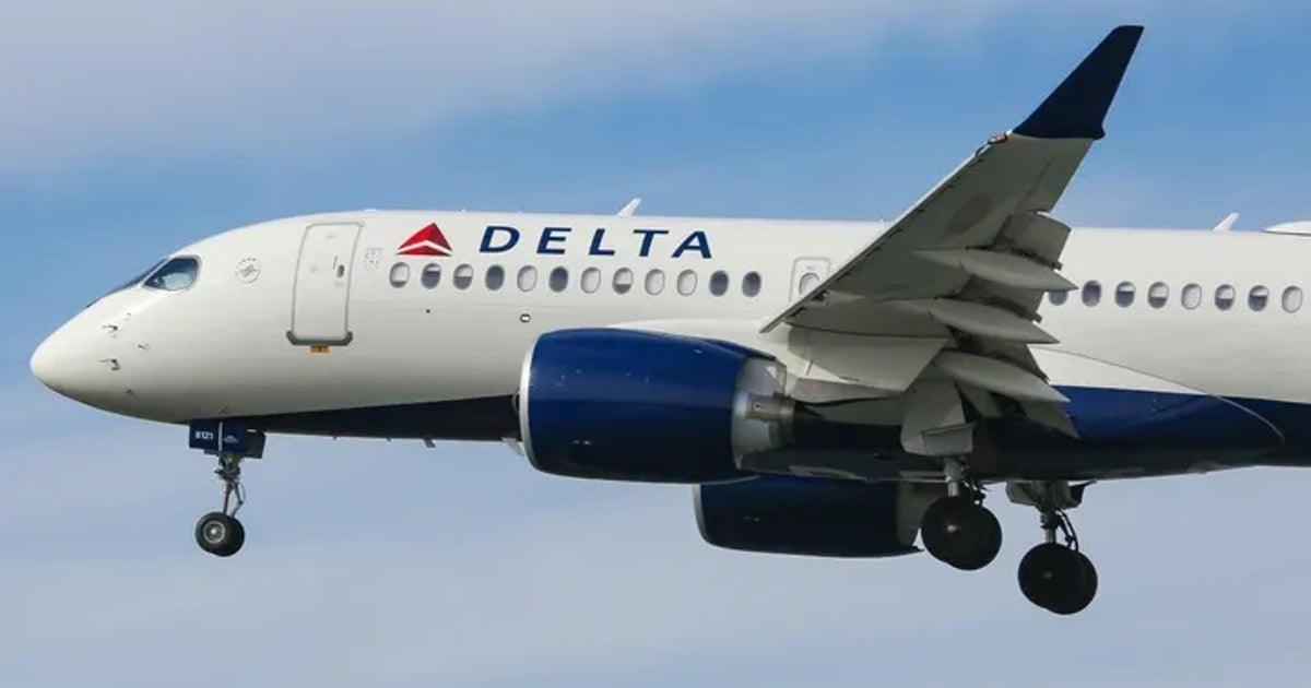 Passengers evacuate down slide at ATL airport shortly after smoke forces emergency landing