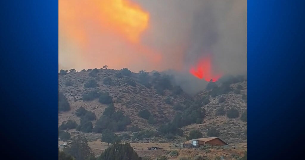 Two massive wildfires converge to rip across 44,000 acres on California-Nevada border as evacuations underway