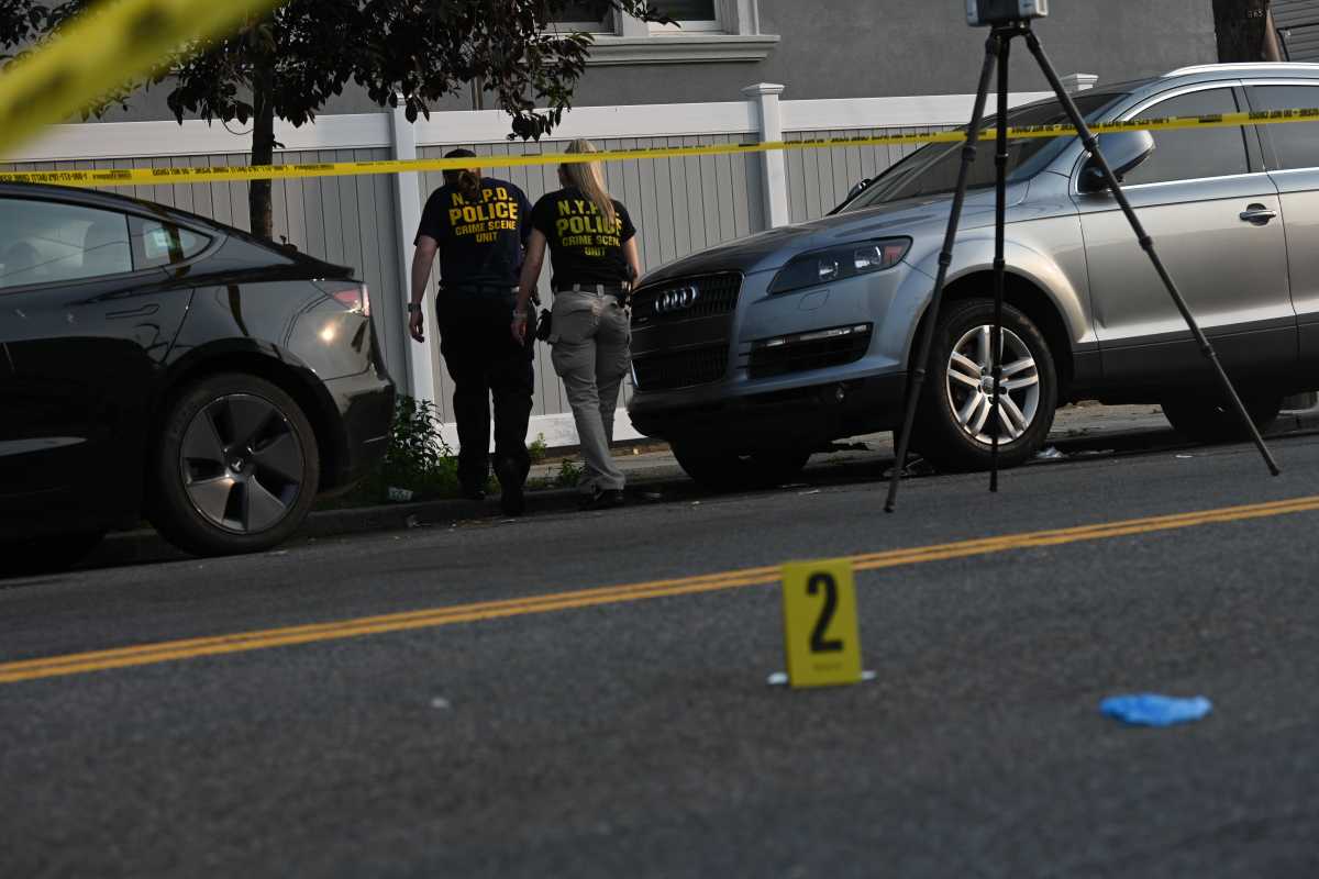 NYPD detectives investigating the scene at Canarsie Pier.