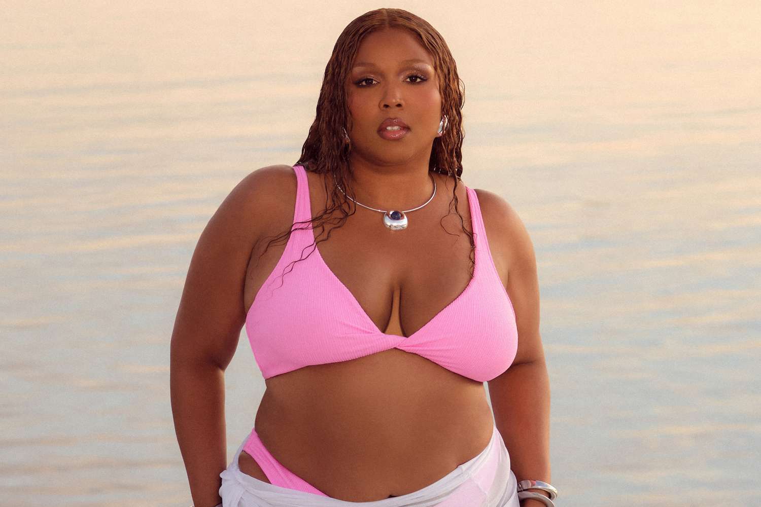 Lizzo rings in ‘Fat Liberation Month’ in a teeny purple string bikini