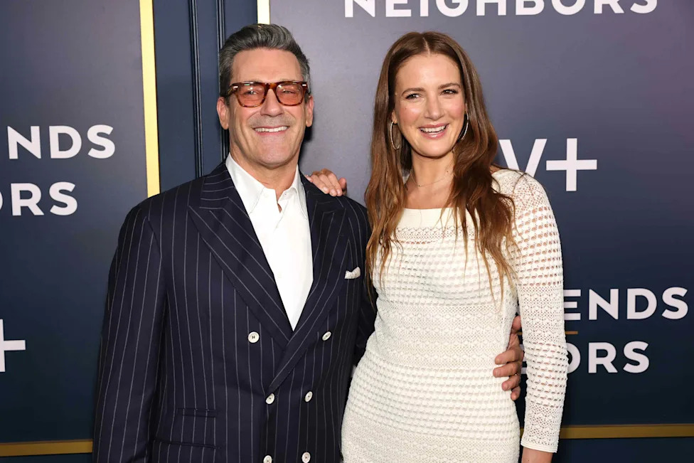 The couple at a red carpet event after their wedding