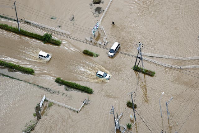 Eight dead, and over 10K left stranded as record-breaking rain pummels Japan