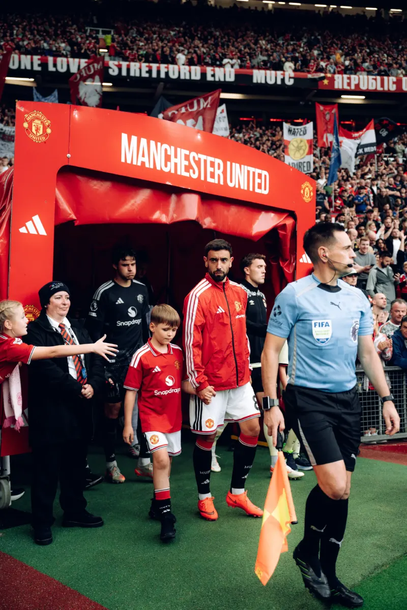 Sons of police officer killed in A66 crash lead out Manchester United at Old Trafford