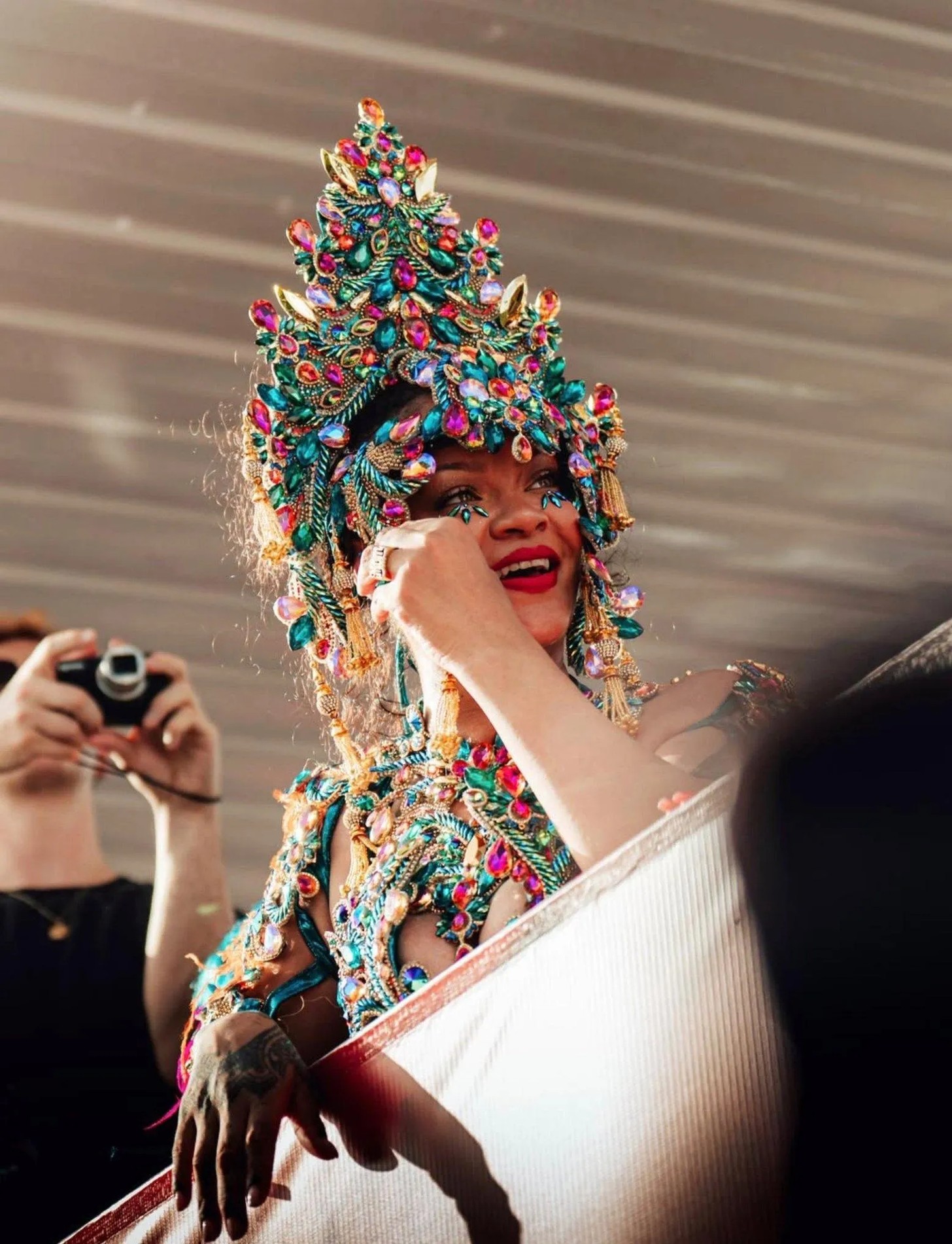 Rihanna smiling and dancing among parade spectators in Barbados
