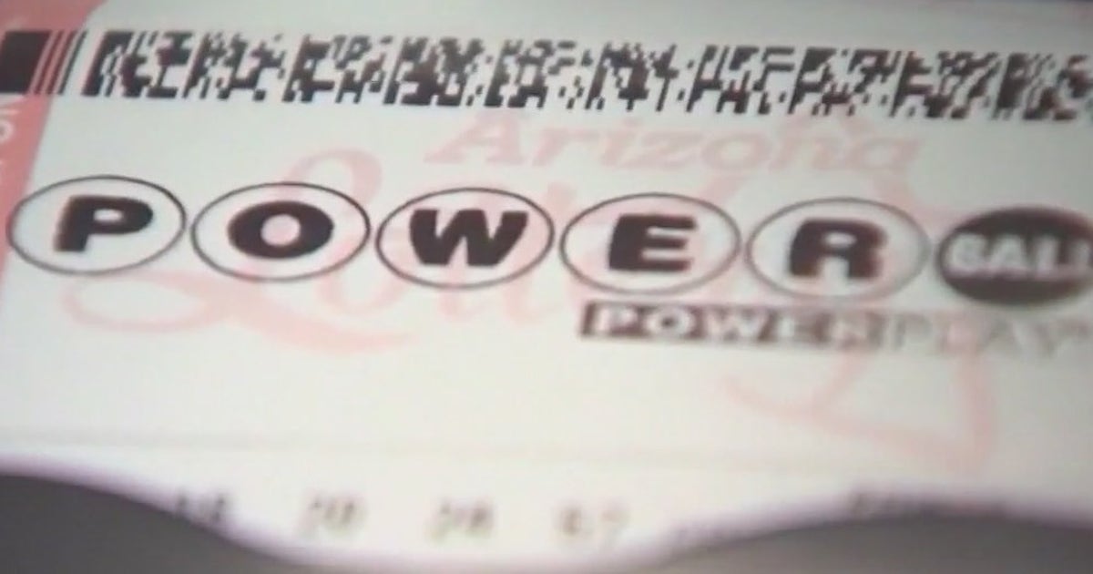 A Powerball ticket holder checking numbers in anticipation of winning.