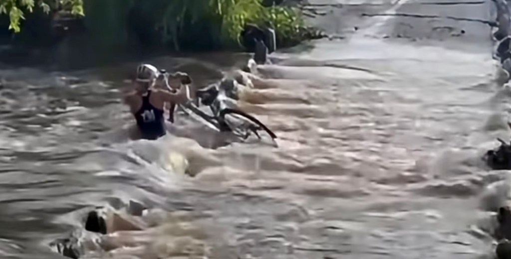 Woman miraculously survives being sucked through flood tunnel as rescuers become victims themselves trying to pull her out