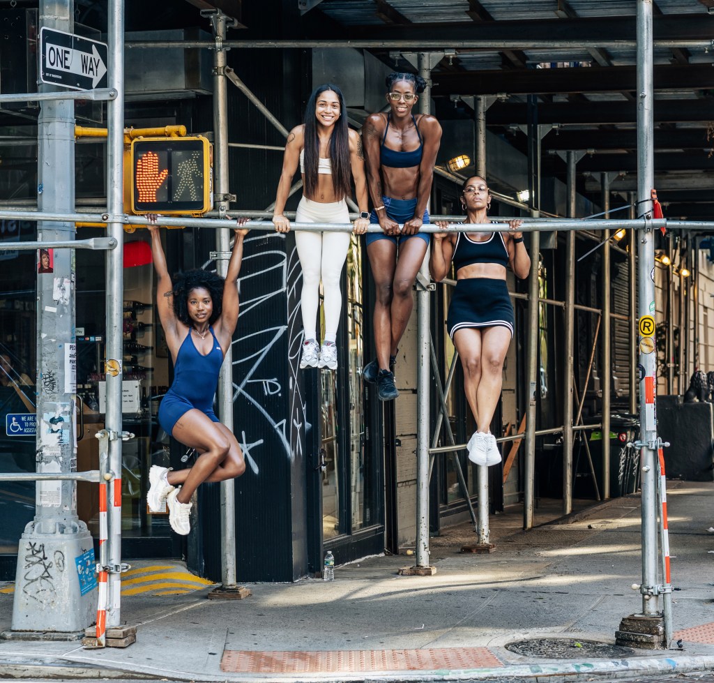 NYC women are hanging from scaffolding, streetlights and subway rails to bust a stubborn fitness myth