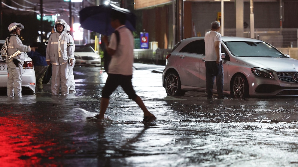 Eight dead, and over 10K left stranded as record-breaking rain pummels Japan