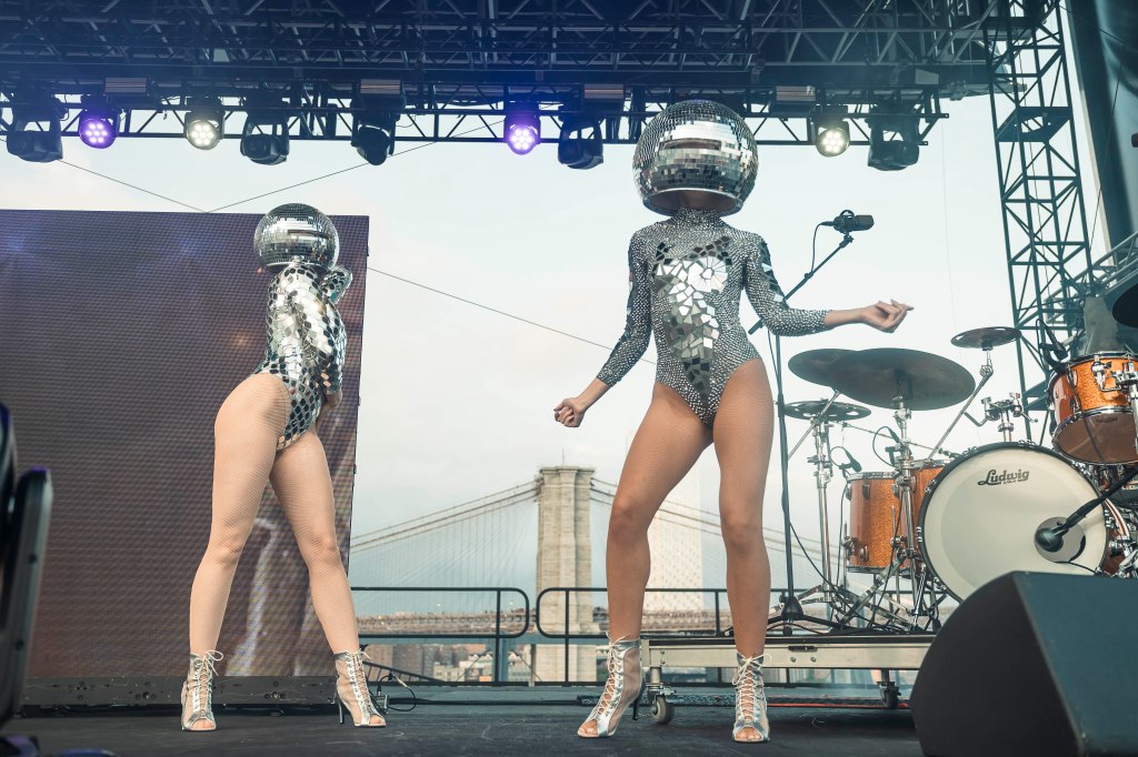 Thousands of jumpsuit-clad partiers boogie to 1970s hits at annual Gimme Gimme party: ‘I just keep coming back’