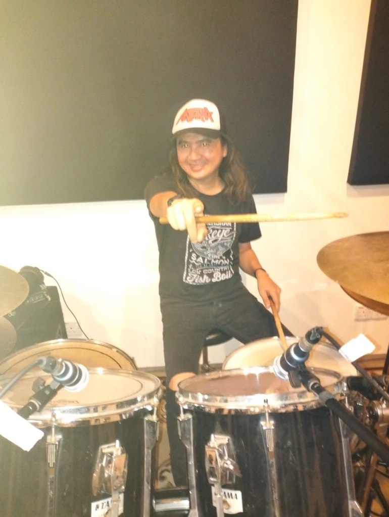 Malaysian rock drummer dies onstage mid-performance after collapsing over his drum kit