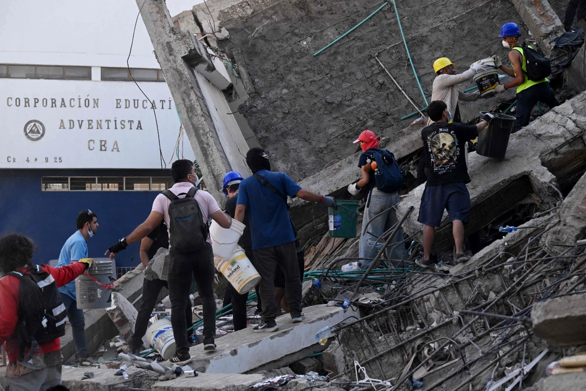 Colombia earthquake survivor loses both triplet sisters, parents in building collapse