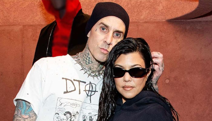 Kourtney Kardashian and Travis Barker couldn't keep their hands off each other during the