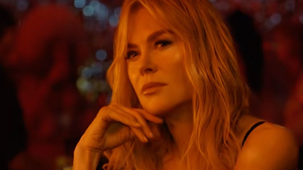 Nicole Kidman cozies up to young pop star, smokes cigarette and downs shot in raunchy music video
