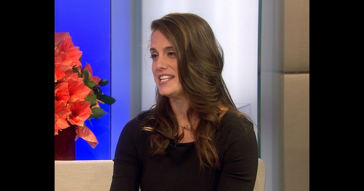 Toni Brattin laughing and reacting to her on-air slip during the wig demonstration
