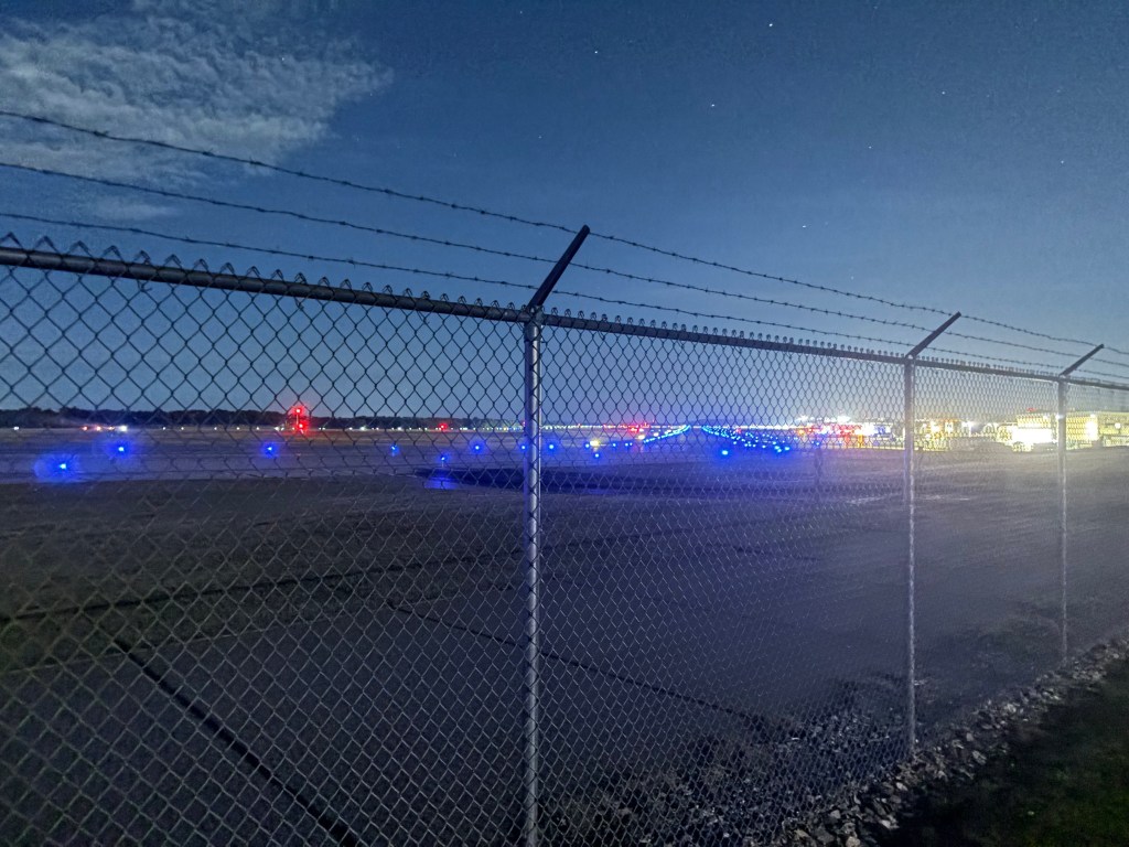 Airport chaos erupts after driver suddenly smashes through fence, hits plane and tractor: police