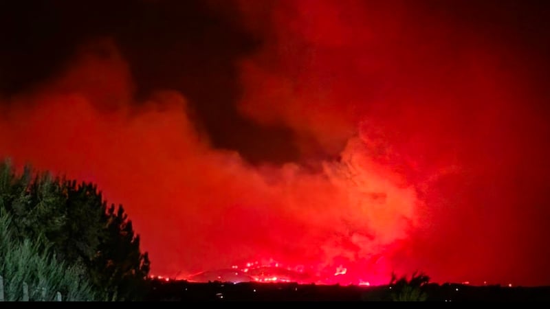 Two massive wildfires converge to rip across 44,000 acres on California-Nevada border as evacuations underway