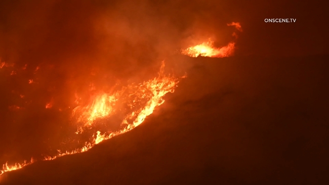 Fast moving wildfire races through El Tejon Pass as evacuation warnings spread