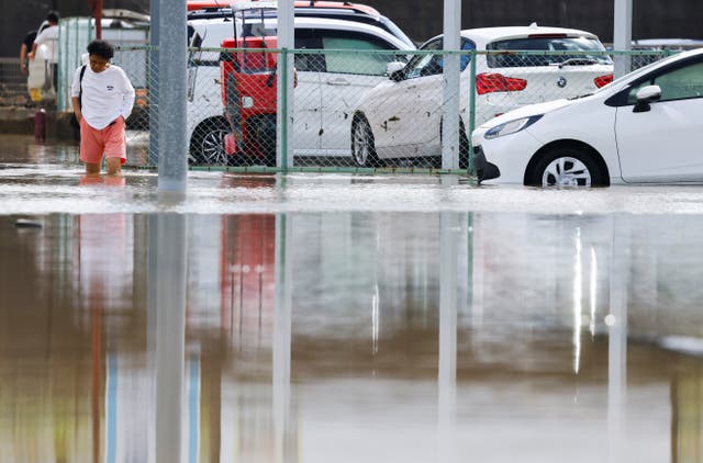 Eight dead, and over 10K left stranded as record-breaking rain pummels Japan