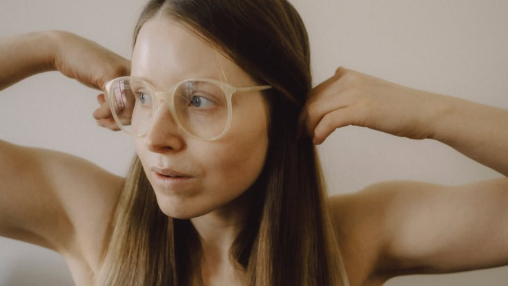 Jessie Cave displaying her long hair, central to her OnlyFans content.