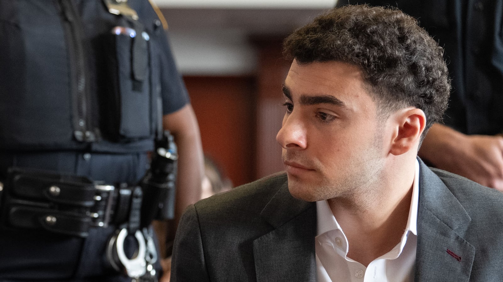 Body language expert reveals truth behind Luigi Mangione's 'relaxed' smile in court